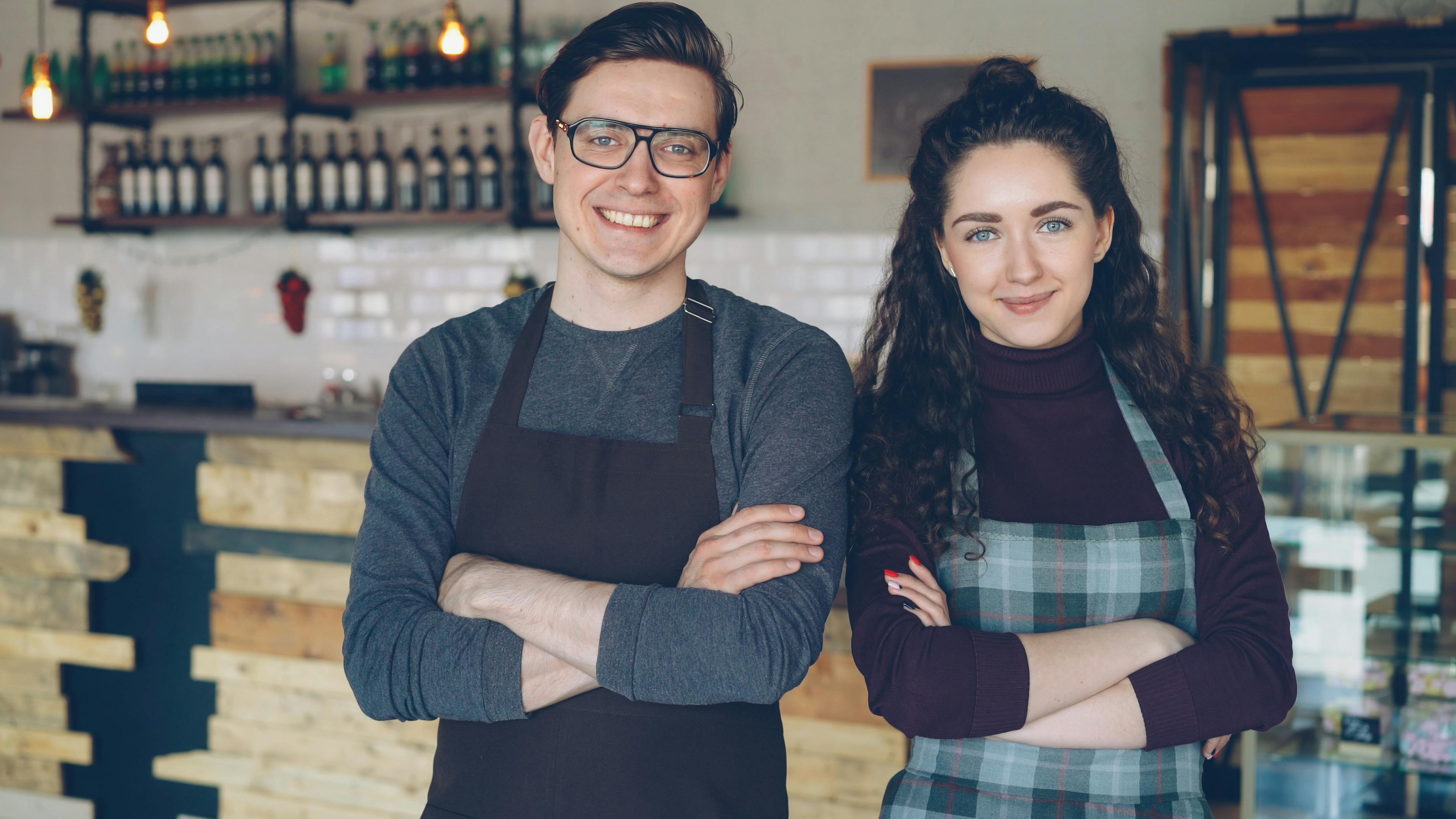 Two business advisors reviewing financial documents at a desk